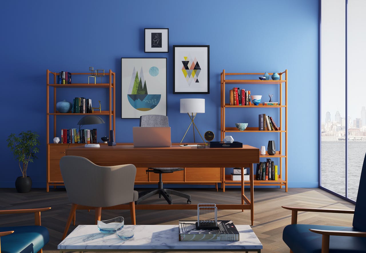 why-choose-us-01 Elegantly decorated home office with modern furniture and a blue wall.